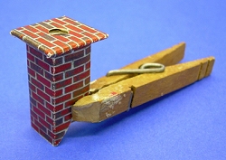The brick version of the chimney after it is glued together. A very fine dark red marker might help with any white areas that the creases reveal. Click for bigger photo.
