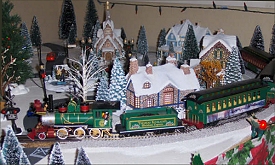 Larry Farnsworth uses Hawthorne Village structures on a styrofoam base to support his railroad. Click for bigger photo.